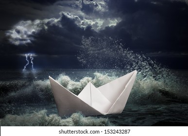 Paper Ship In Storm Concept