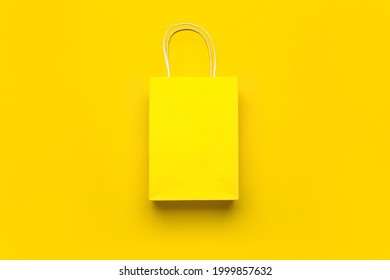 Paper shopping bag on color background - Shutterstock ID 1999857632