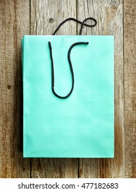 Paper Shopping Bag On Wooden Table, Top View