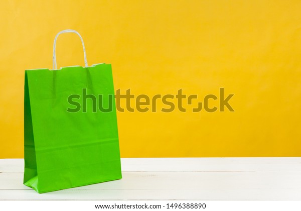Download Paper Shopping Bags On Bright Yellow Stock Photo Edit Now 1496388890 Yellowimages Mockups