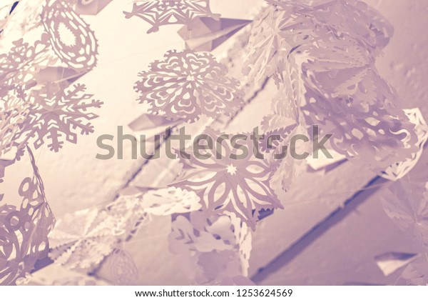 Paper Snowflakes Hanging Against White Ceiling Stock Photo