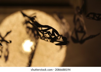 Paper Snowflakes Hanging From A Lamp