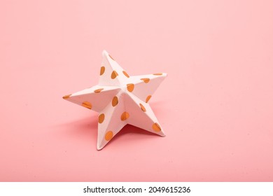 
Paper Star On Pink Background