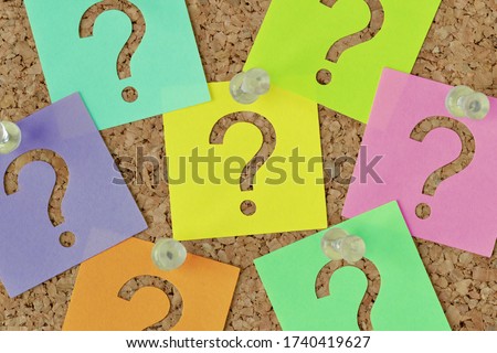 Paper sticky notes with question mark on notice board - Concept of faq and finding information