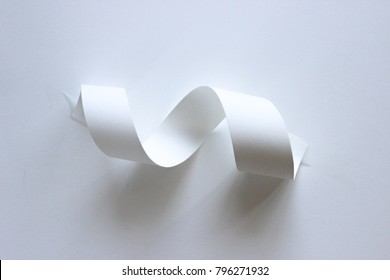 Paper Swirl Sculpture With Light And Shade And Shadows On White Background