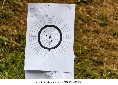 Paper Target On A Shooting Range With Bullet Holes