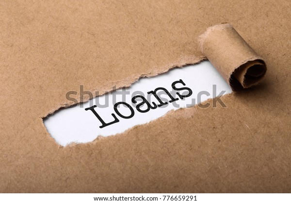 Paper tear background\
with word Loans.
