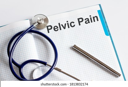 Paper with text PELVIC PAIN on a table with stethoscope