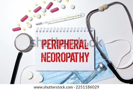 Paper with text PERIPHERAL NEUROPATHY on a table with stethoscope. Medical concept.