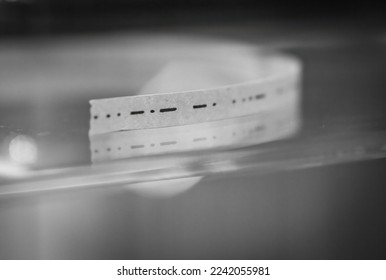 Paper ticker tape with Morse code