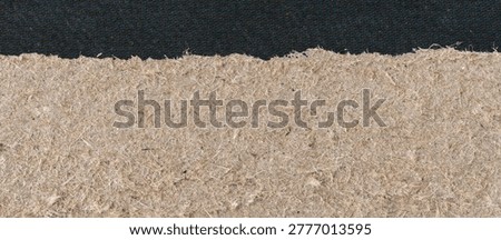 Paper torn super macro texture, ripped cardboard edge with black paint. Old kraft carton piece, horizontal packaging paper closeup pattern