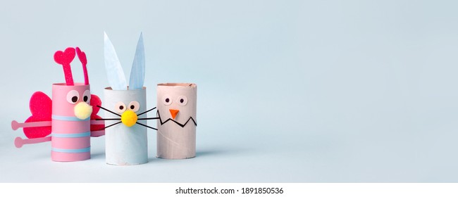 Paper Toy Happy Easter Home Party. Easy Crafts For Kids On Blue Background, Copy Space, Die Creative Idea From Toilet Tube Roll, Recycle Reuse Eco Concept, Kindergarten Daycare, Banner