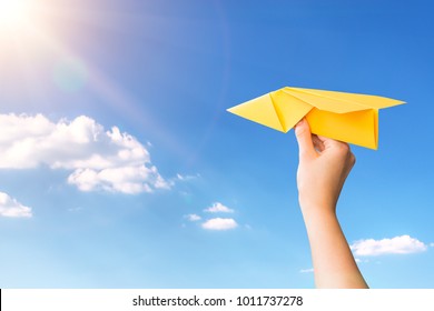 Paper Travel Sky Plane Child Flying Yellow Fun Human Leisure Kid Throw View Throwing Handmade Freedom Object Up Air Airline Joy Concept - Stock Image