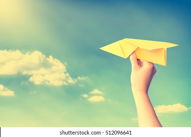 Paper Travel Sky Plane Child Flying Yellow Fun Human Leisure Kid Throw View Throwing Handmade Freedom Object Up Air Airline Joy Concept - Stock Image