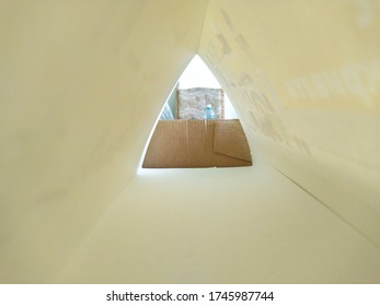 Paper triangle on the table - Shutterstock ID 1745987744