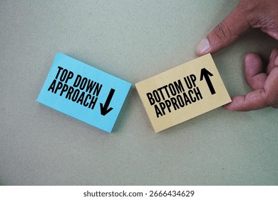 Paper with two words top down approach and bottom up approach. two distinct methods used in various fields, including project management, decision-making, and even reading.