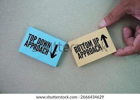 Paper with two words top down approach and bottom up approach. two distinct methods used in various fields, including project management, decision-making, and even reading.