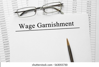 Paper With Wage Garnishment On A Table