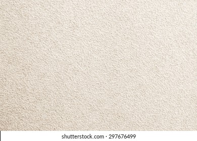 Paper wallpaper the walls of beige house with rough scratch uneven on cement concrete wall texture background blank, light cream vintage surface carpet, soft wrinkled pattern and faded lines seamless.