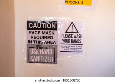 Paper Warning Sign On A Wall Please Wash Your Hands