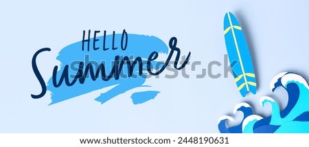 Paper waves and mini surfboard on light blue background. Hello Summer