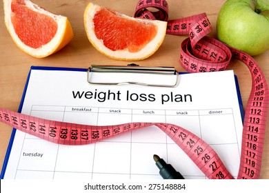 Paper With Weight Loss Plan And Grapefruit