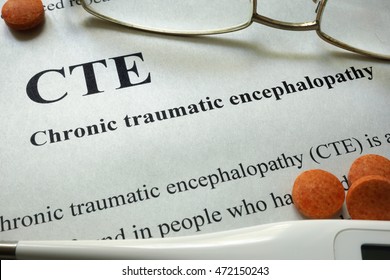 Paper With Words CTE, Chronic Traumatic Encephalopathy  And Glasses. Medical Concept.