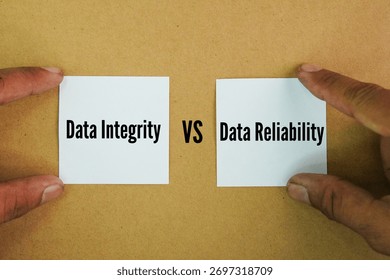 Paper with the words Data Integrity vs. Data Reliability. Data quality is essentially the measure of data integrity. A dataset's accuracy, completeness, consistency, validity, uniqueness, and timeline