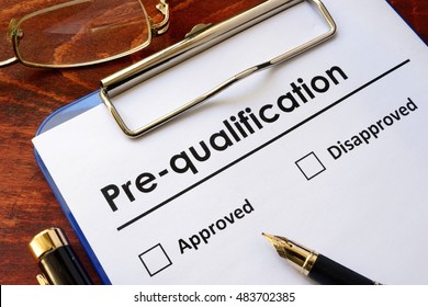 Paper with words Pre-qualification on a wooden surface. - Shutterstock ID 483702385