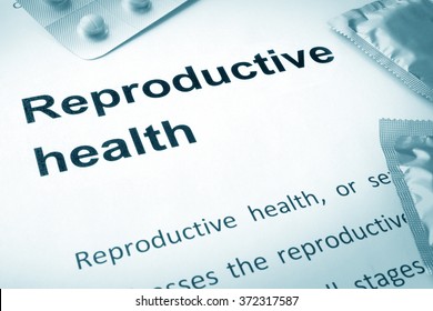 Paper With Words Reproductive Health And Contraceptives.