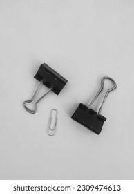 paperclip and binder clips on white background 