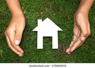 Papercut Family House In Hand Image 