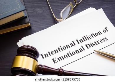 Papers about intentional infliction of emotional distress IIED and a gavel. - Shutterstock ID 2159695733