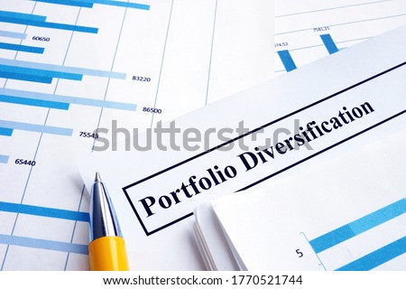 Papers about investment portfolio diversification and pen.