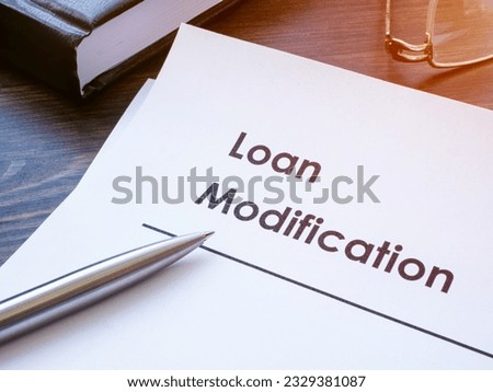 Papers about Loan modification on the table.