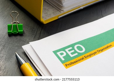 Papers about PEO professional employer organization and yellow folder. - Shutterstock ID 2177555113