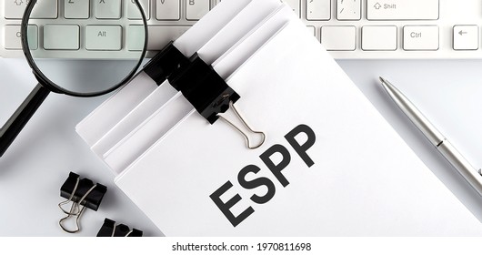 Papers With ESPP Employee Stock Purchase Plan On Keyboard