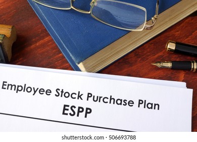 Papers With ESPP Employee Stock Purchase Plan On A Table.