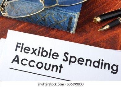 Papers With Flexible Spending Account FSA On A Table.
