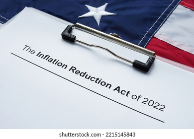 Papers with The inflation reduction act of 2022 and flag. - Shutterstock ID 2215145843