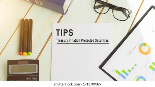 Papers with text, TIPS on a table, business concept.