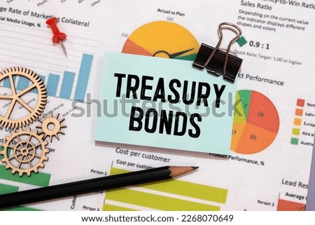 Papers with text, treasury bonds on a table, business concept