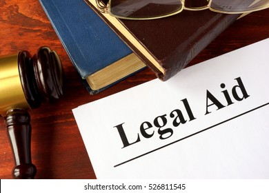 Papers With Title Legal Aid On A Table.