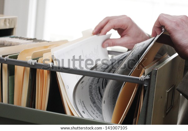 Paperwork in a filing\
cabinet