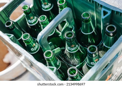 Paphos, Cyprus - Oct 28, 2014: Close-up of multiple carlsberg empty glass bottles of beer in plastic box