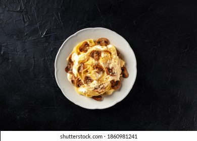 Pappardelle Pasta With Mushrooms, Cream Sauce And Grated Parmesan Cheese, Overhead Shot