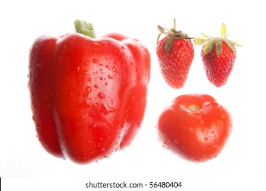 Paprica pepper, two strawberries and tomato on white - Powered by Shutterstock