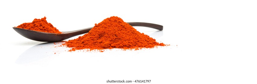 Paprika Powder In Wooden Spoon Over White Background