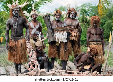 PAPUA (IRIAN JAYA), ASMAT , INDONESIA : JANUARY 18: Asmats headhunters and woodcarver in traditional and national tribal customs, dresses  on January 18, 2009 in Papua (Irian Jaya), Indonesia. 