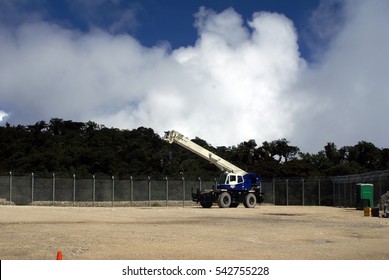 PAPUA NEW GUINEA - CIRCA 2015: Crane Parked In A Clearing For Construction Of A Gas Well In A Highland Jungle In Papua New Guinea  